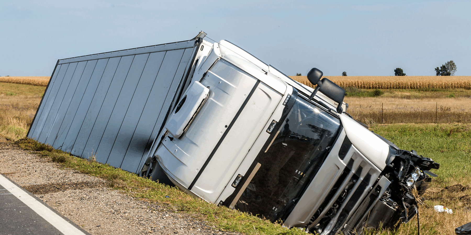 truck accident on shoulder of freeway