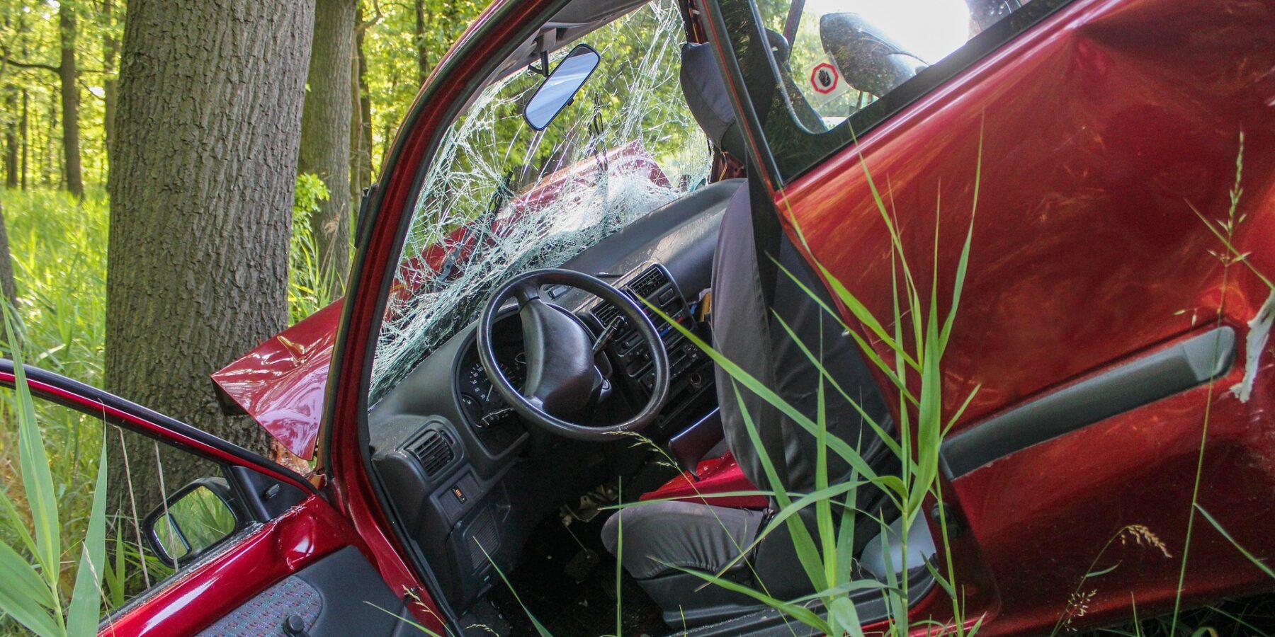 car accident into ditch and tree