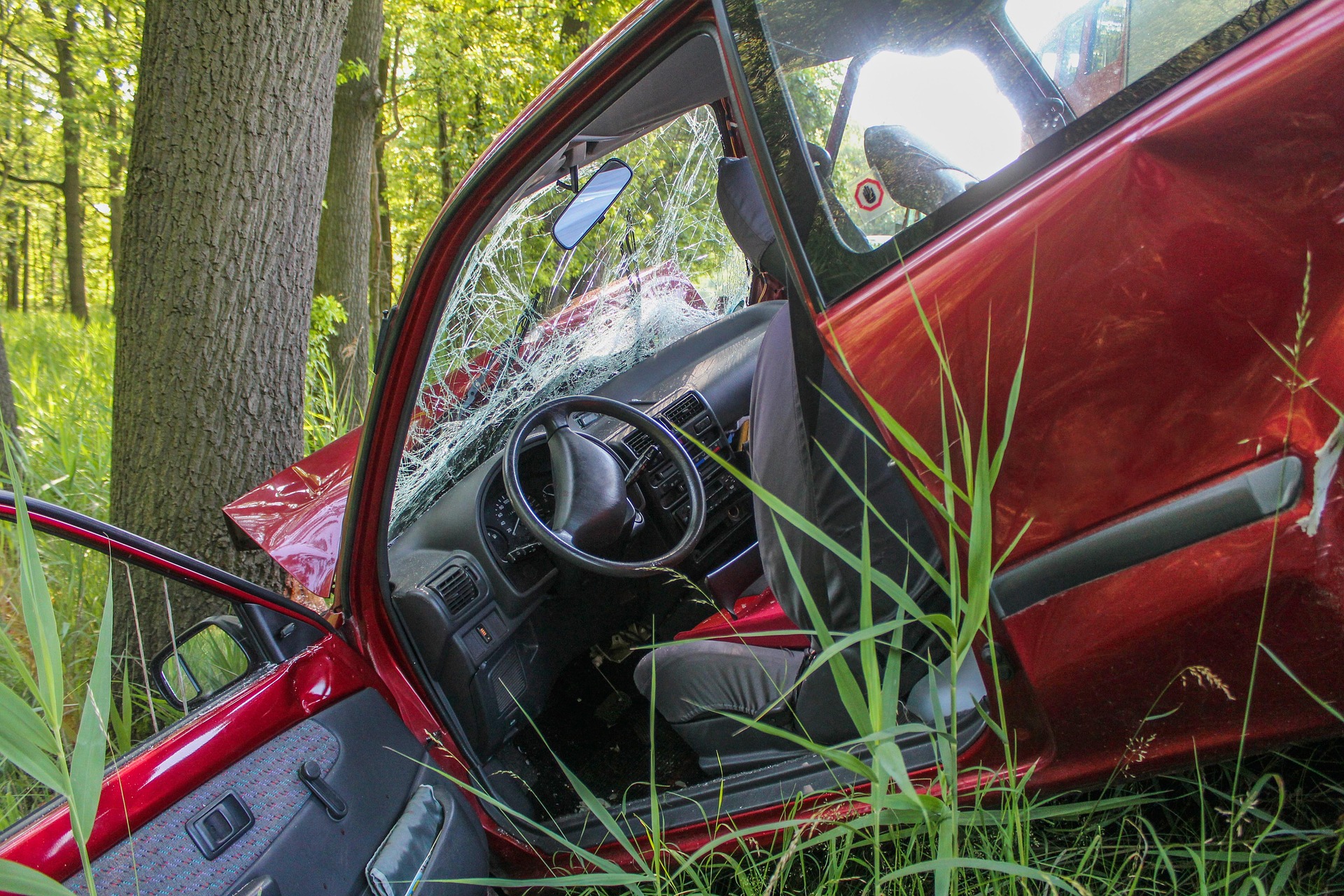 car accident into ditch and tree