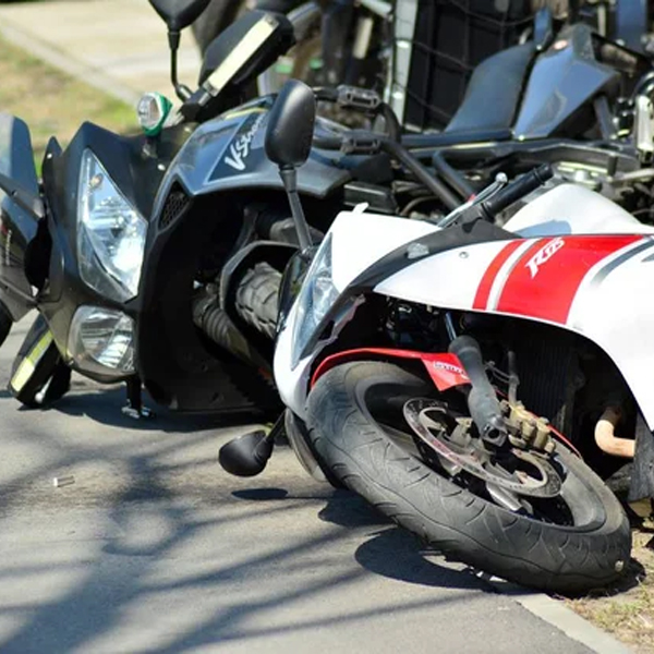 Motorcycle down on the road after a crash